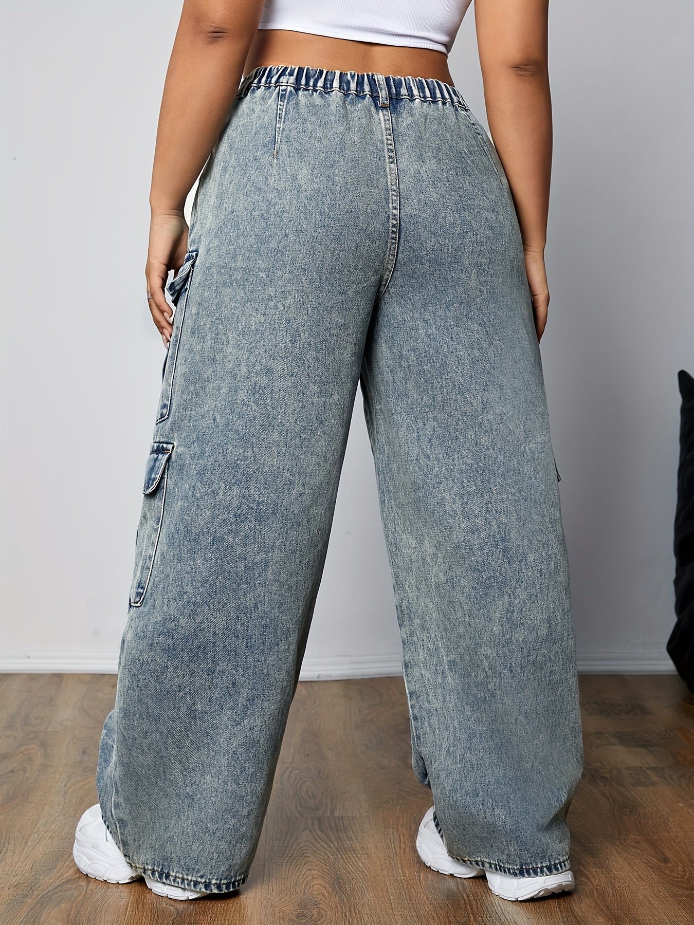 Stylish plus size loose fit cargo jeans with side flap pockets, non-stretch denim, and straight hem for women's casual wear.