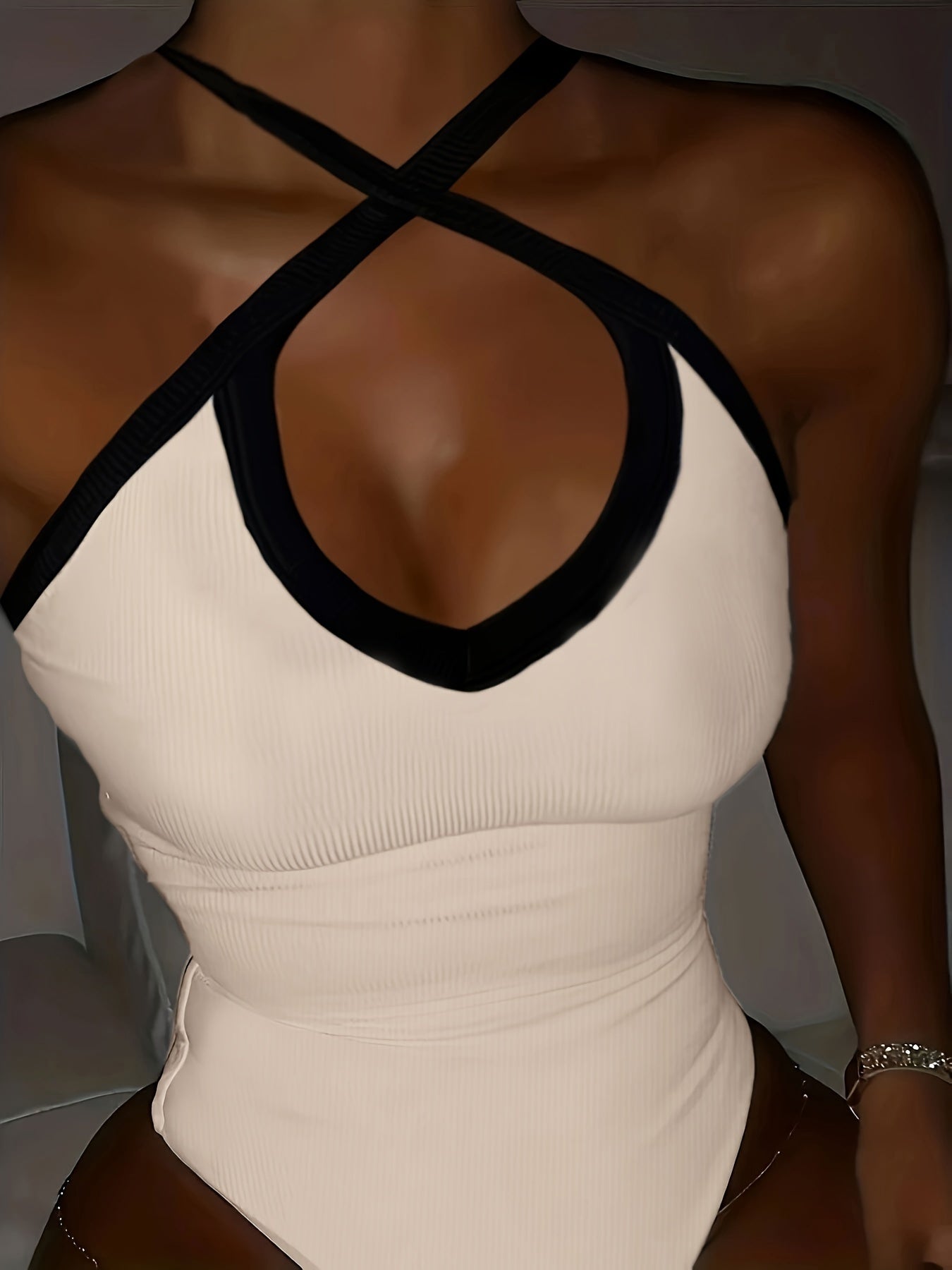Chic Colorblock Bodysuit with Crisscross Detail - Sleeveless, Figure-Hugging, Ideal for Evening Wear