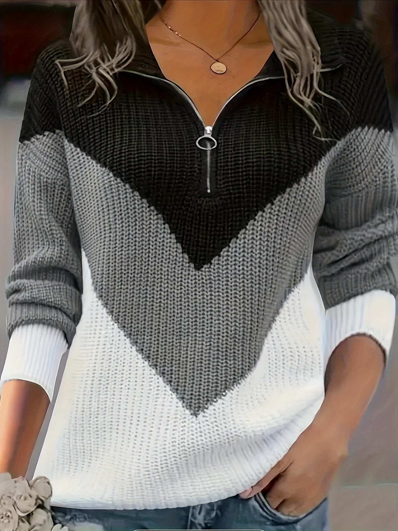Women's plus size acrylic pullover sweater in black, gray, and white patchwork with a zipper and v-neck design.