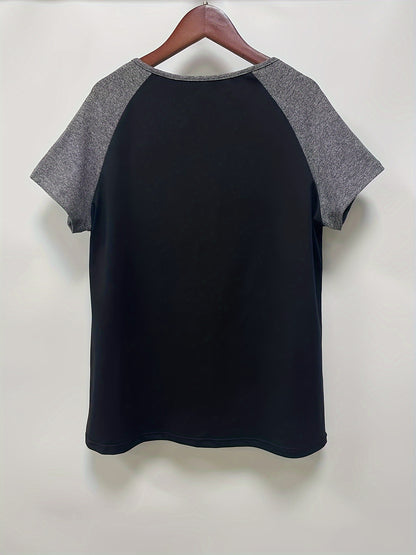 Black and gray short-sleeve t-shirt hanging on a wooden hanger against a white background.