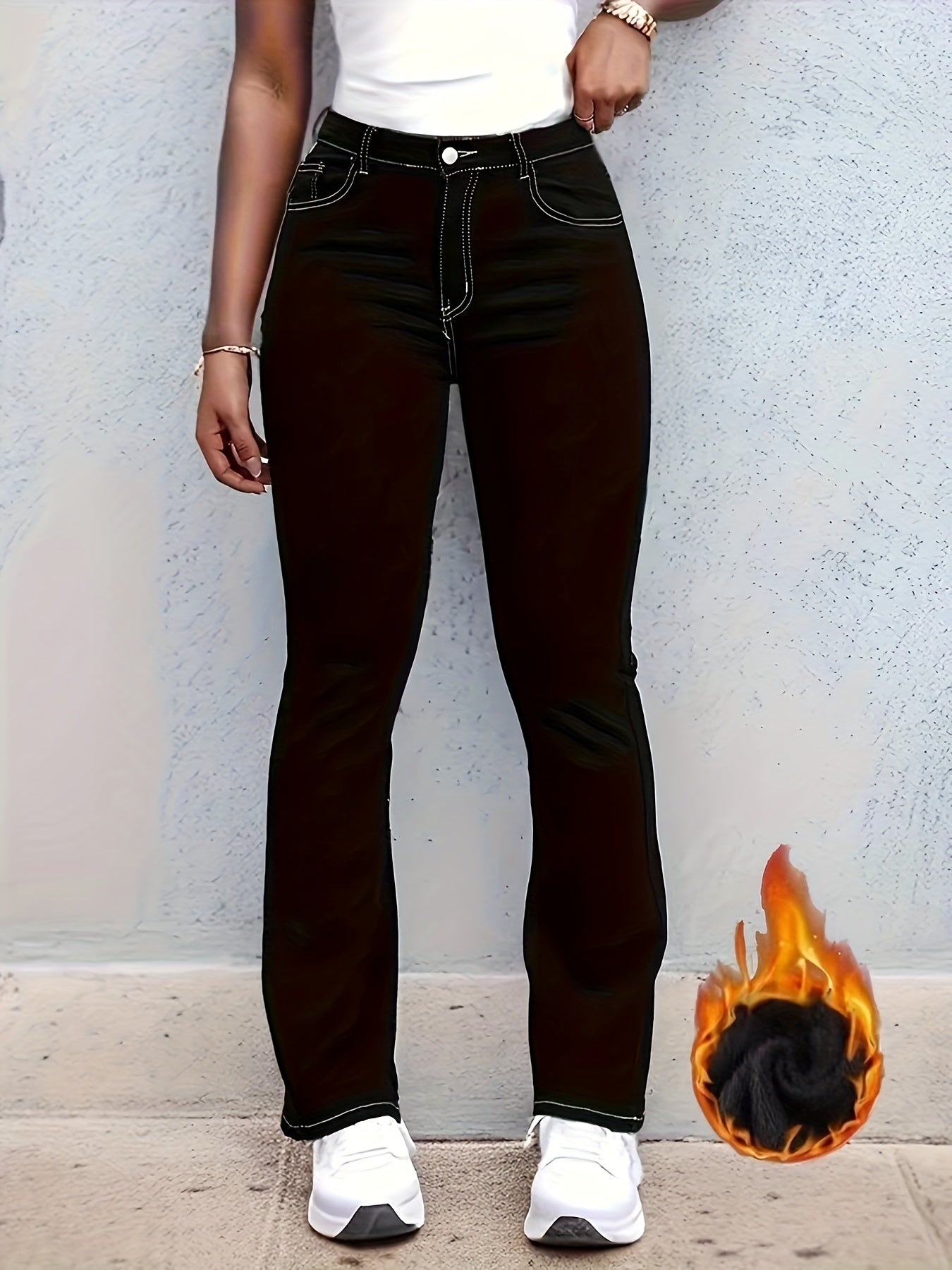 Plus size black flare leg denim pants with flower embroidery, plush lined for winter, women's clothing, worn by a model with white top