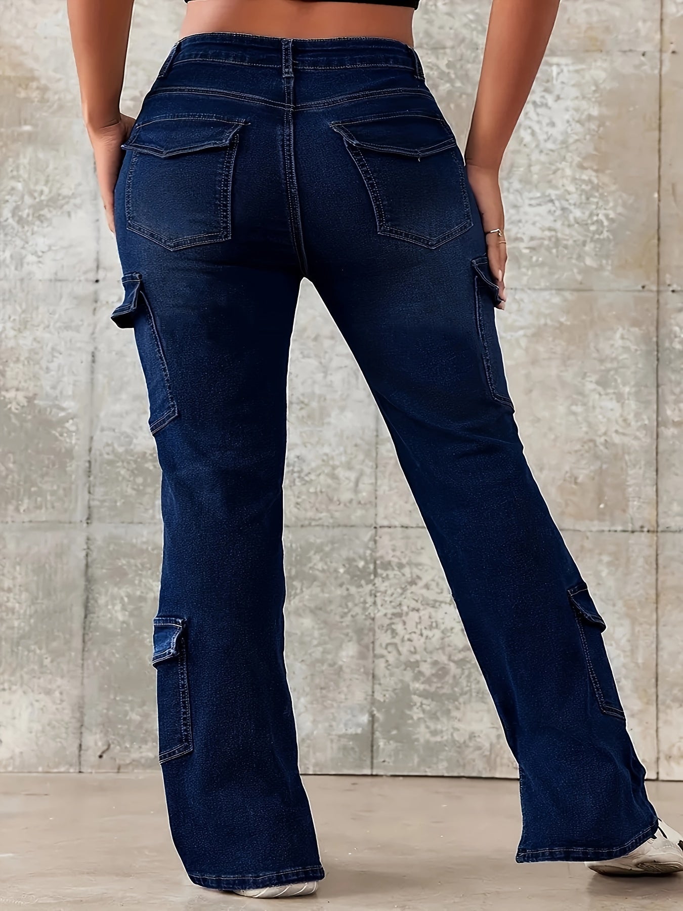 Plus size women's loose-fitting denim jeans with split hem, featuring stylish pockets and slight stretch for casual weekend wear.