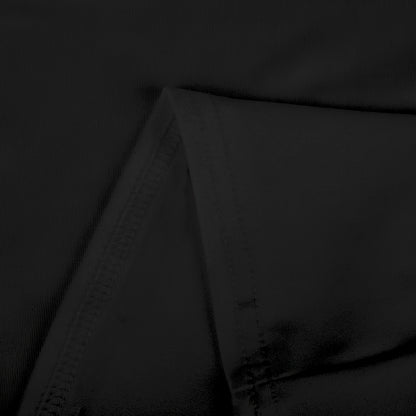 Close-up of black knit fabric showing detailed stitching and texture