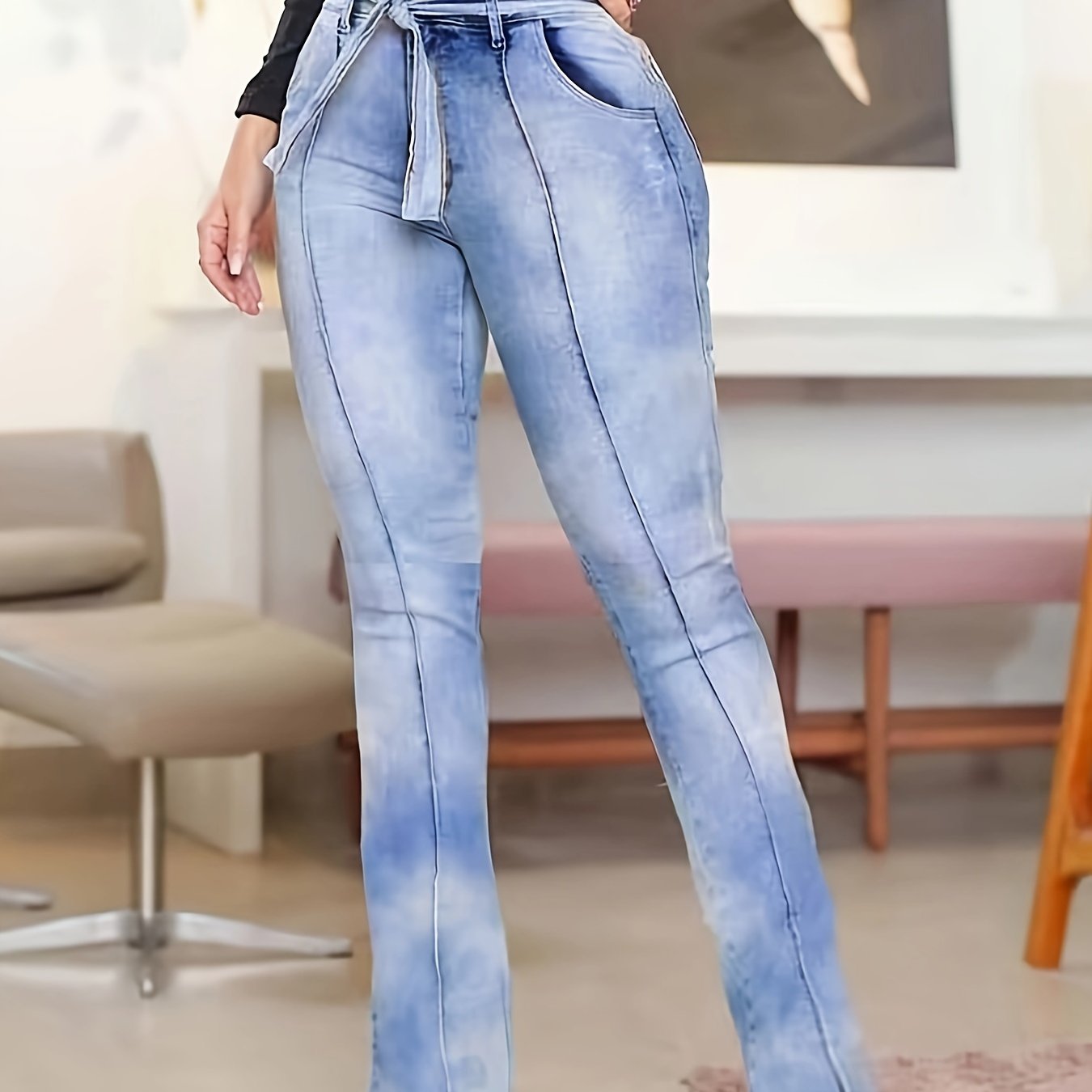 Chic plus size women's high waist jeans with bowknot belt, split hem, ruched pintuck detail, flared leg, washed blue denim pants