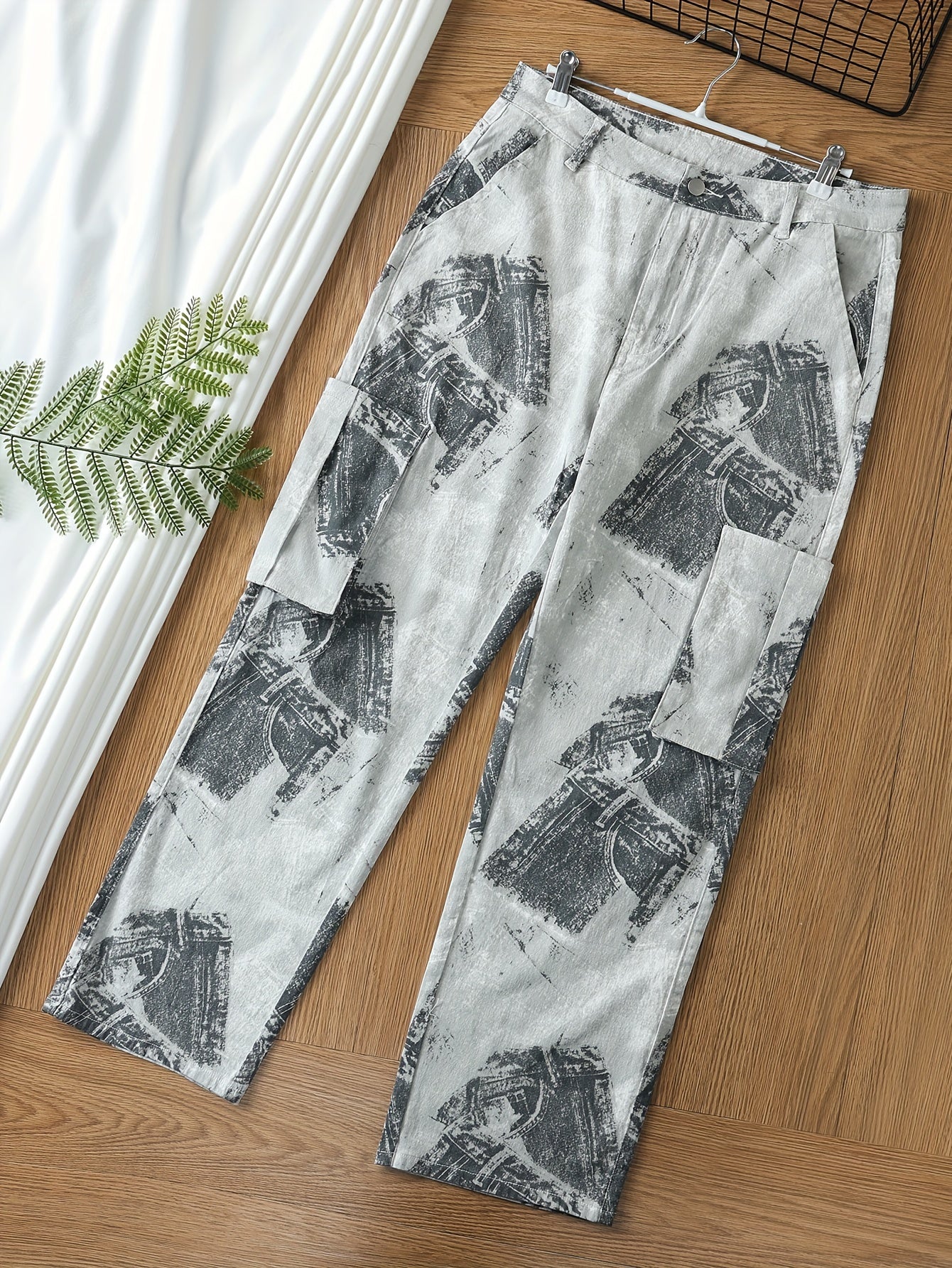 Plus Size Women's High Stretch Camo Print Cargo Jeans with Multiple Pockets and Button Fly on Wooden Floor Background