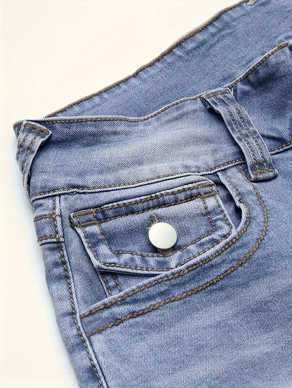 Closeup of Double Buttons Slim Fit Washed Blue Casual Style Zipper Button Closure Denim Pants pocket, women's jeans with white button.