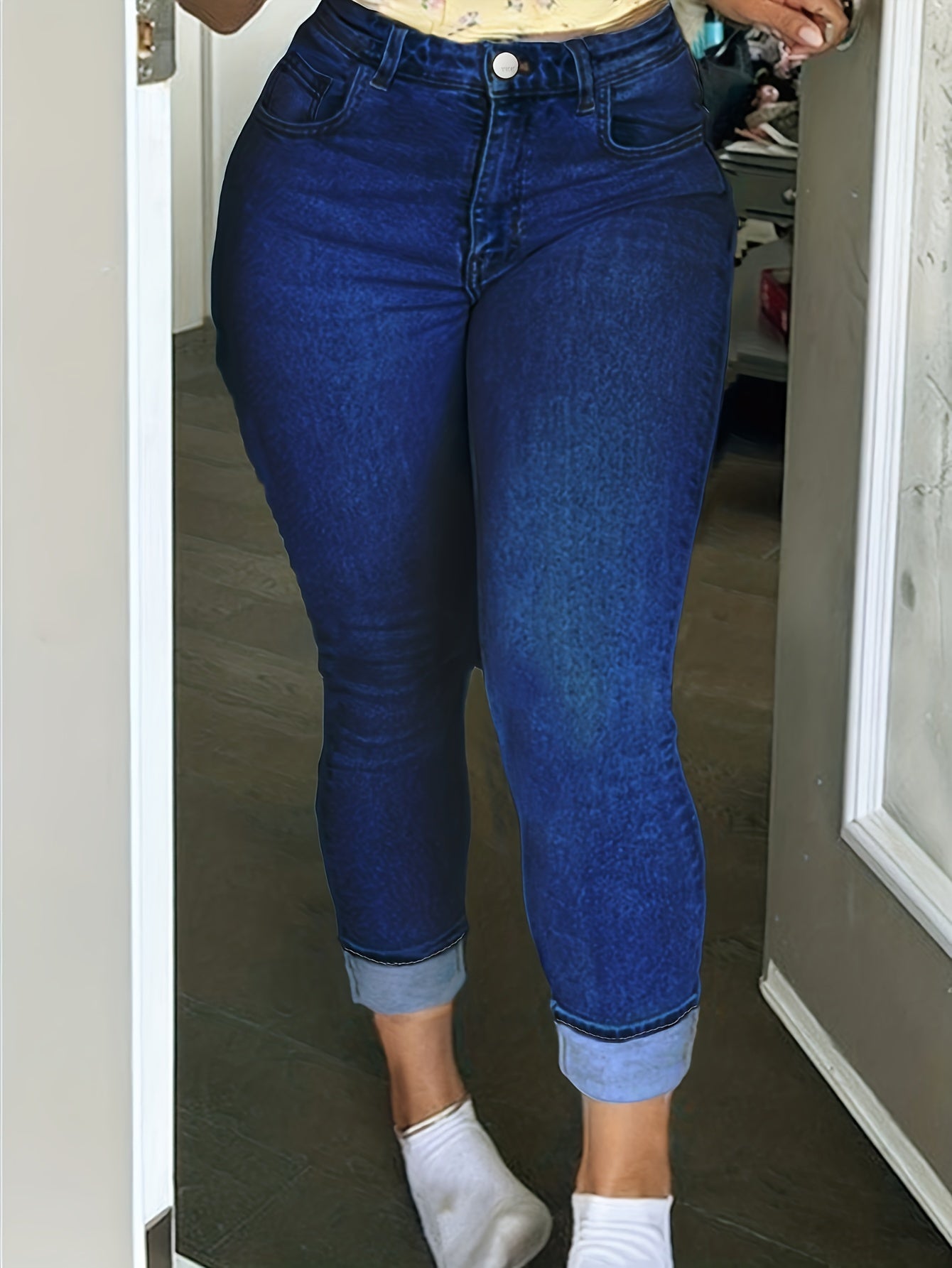 Plus size women's skinny fit denim pants with zipper button closure in washed blue, high waist, casual style, medium stretch fabric.