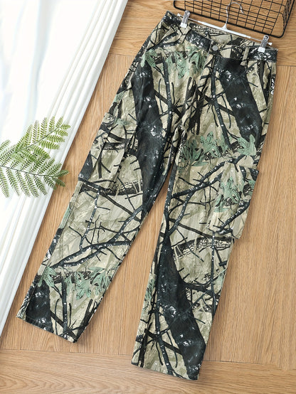 Plus size women's high stretch camo print cargo jeans with multiple pockets, button fly, and relaxed fit on wooden floor with greenery.