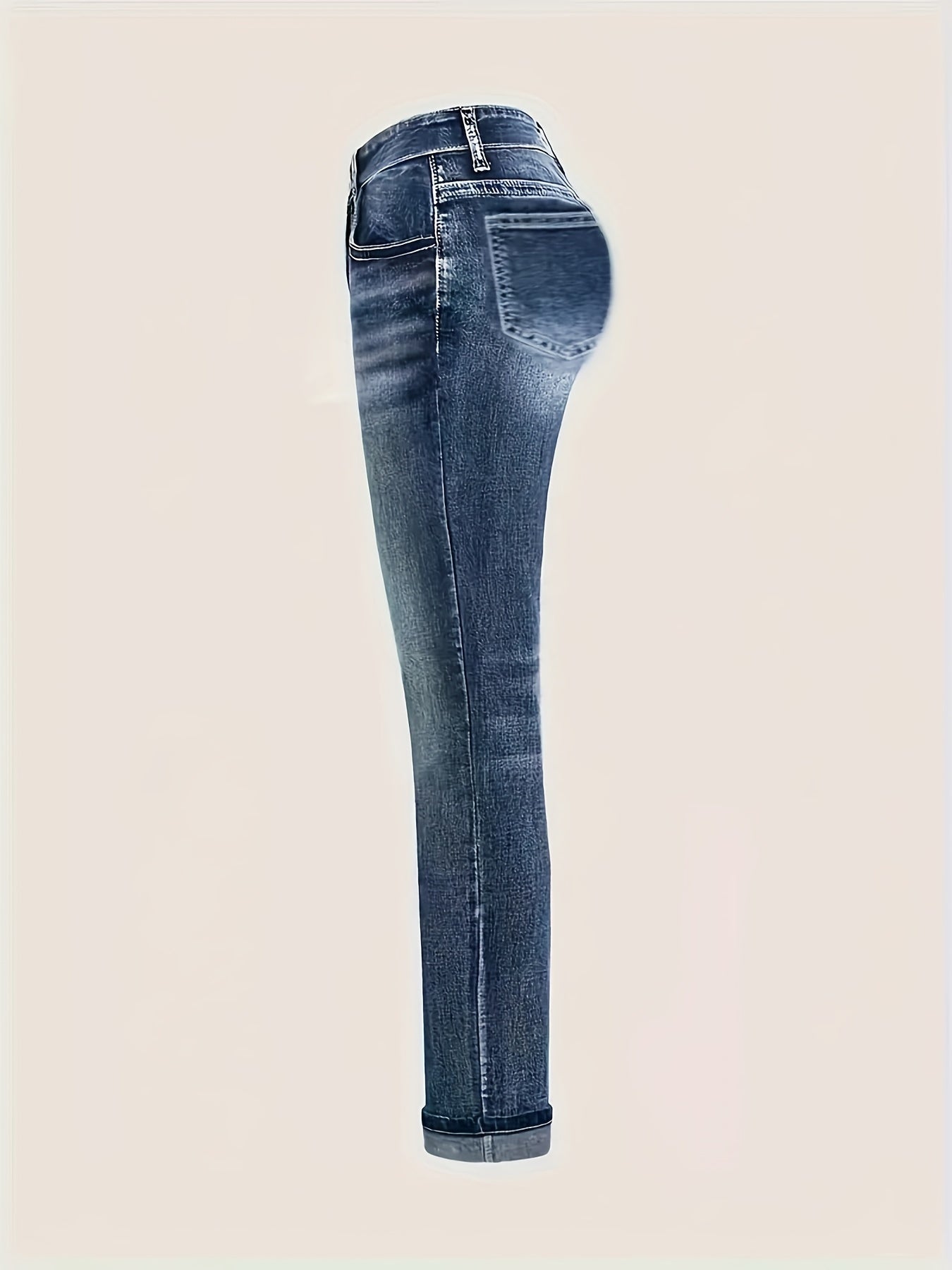 side view of chic plus size embroidered skinny jeans for women in stretch denim with geometric pattern and casual style