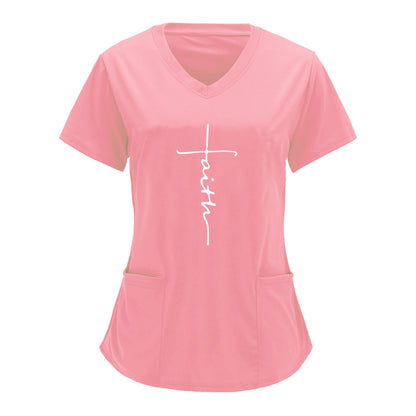 Pink V-neck scrubs top with "Faith" graphic print and practical patch pockets for healthcare professionals.