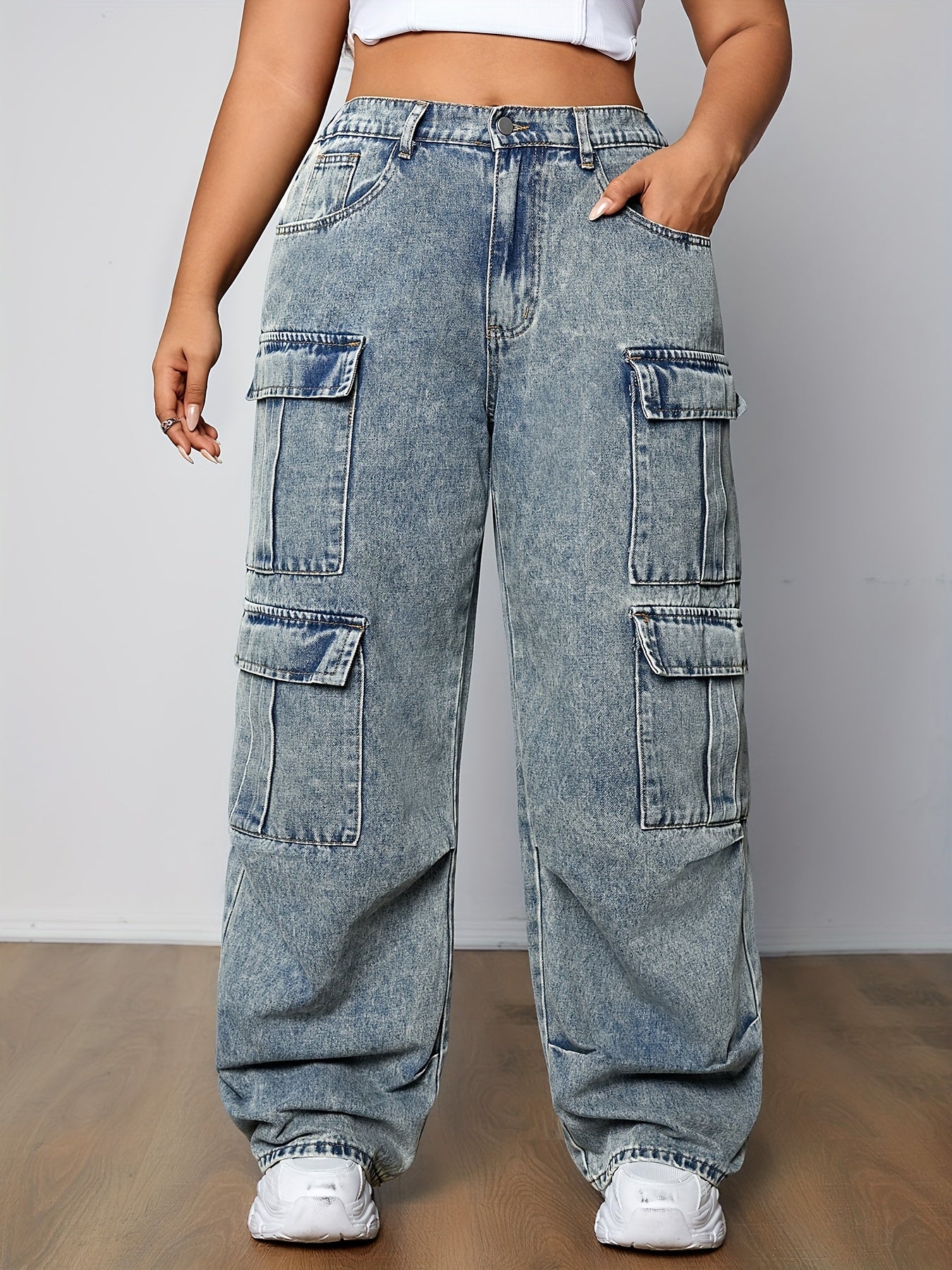 Plus size cargo jeans with multi-pocket design, side flap pockets, and zipper fly. Loose fit, long length denim pants for casual streetwear style.