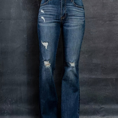 Stylish plus size flared leg jeans with high rise and ripped detailing in dark denim, designed for curvy women.