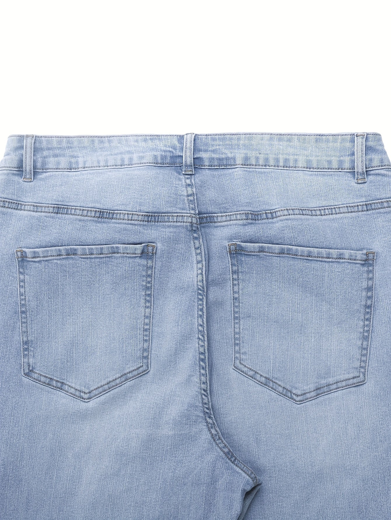 Back view of light blue plus size women's bell-bottom jeans with two back pockets and a solid color, casual Y2K style.