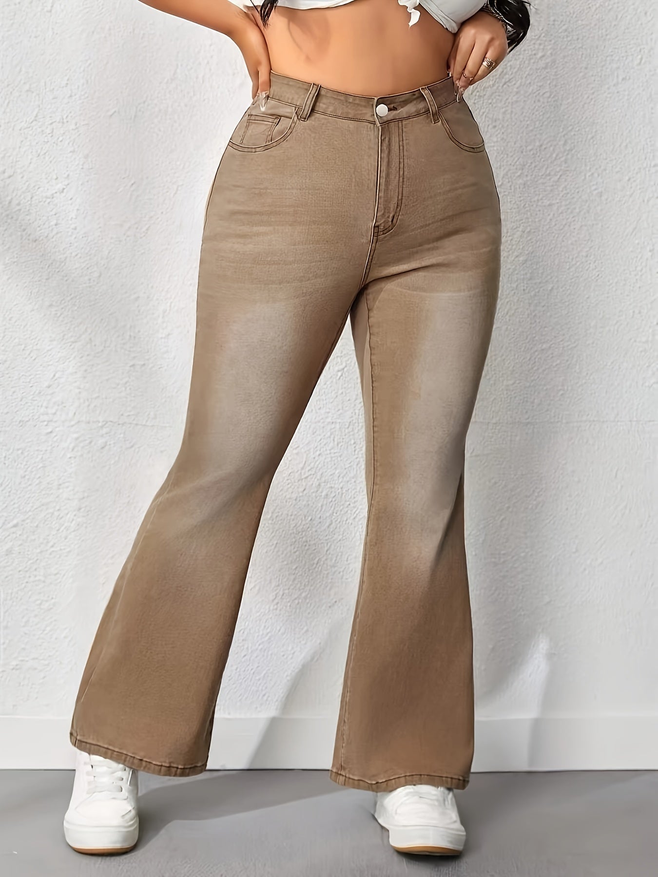 Plus size washed brown flare leg high rise bell bottom jeans for women, casual style, medium stretch denim, solid color.