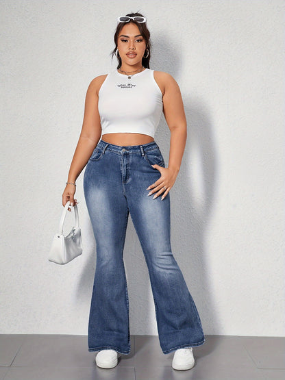 Woman wearing Womens Retro Blue Denim Flare Jeans with Chic Embroidered Pockets and White Crop Top, showcasing fashionable bell bottom style.