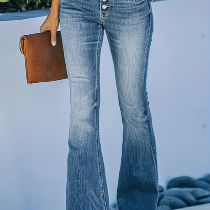 Plus size stretchy blue bell bottom flare leg jeans with whisker wash finish, high-waisted, comfortable fit, worn with a brown clutch