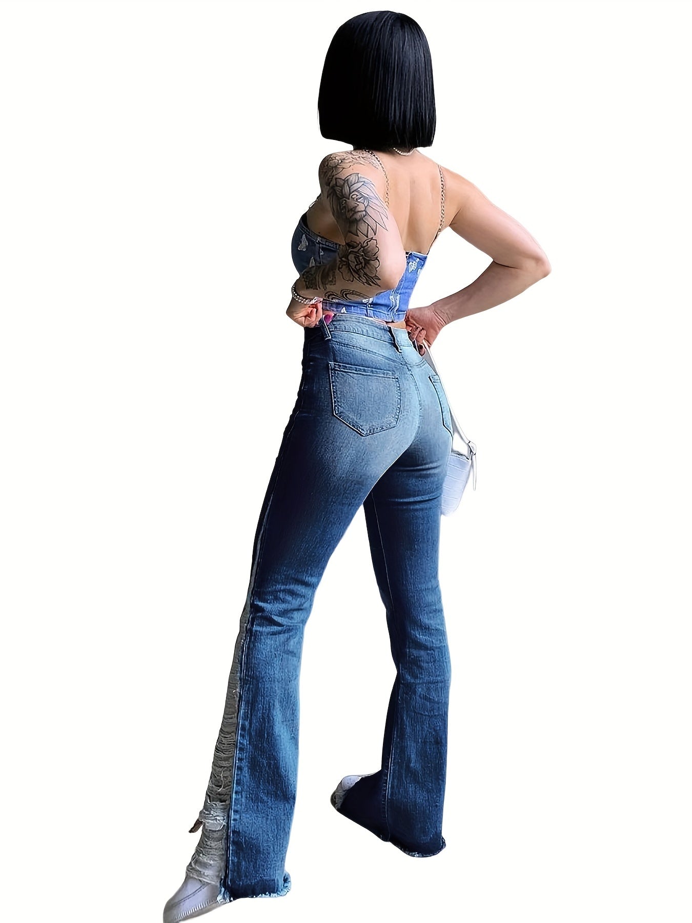 Plus size women's flare leg jeans with split hem, fringe trim, and button fly, perfect for Carnaval Music Festival.