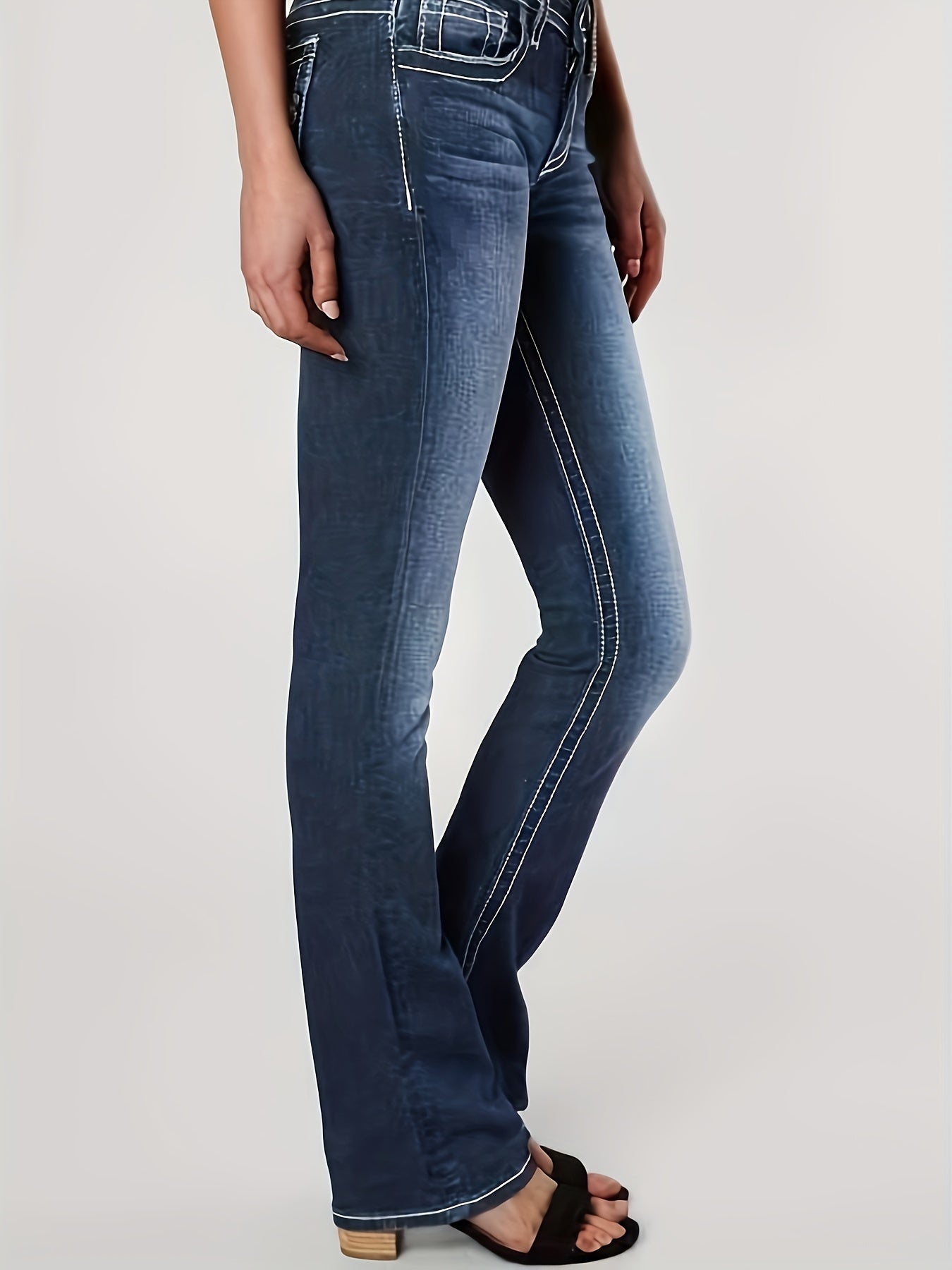 Women's plus size embroidered bell bottom jeans in casual stretch denim with geometric pattern, fashionable flared pants.