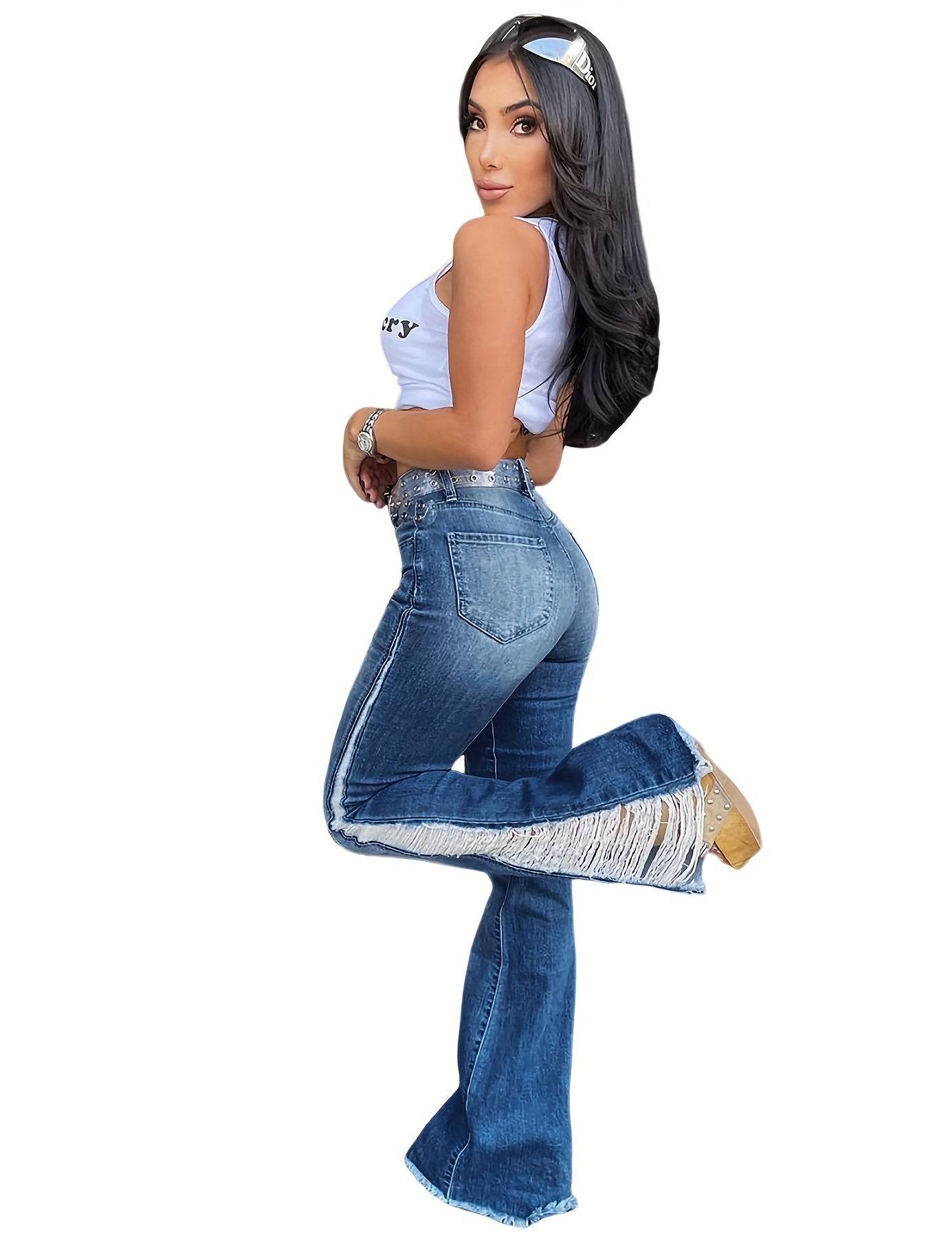 Woman wearing plus size casual jeans with ripped fringe trim, flare leg, perfect for Carnaval Music Festival.