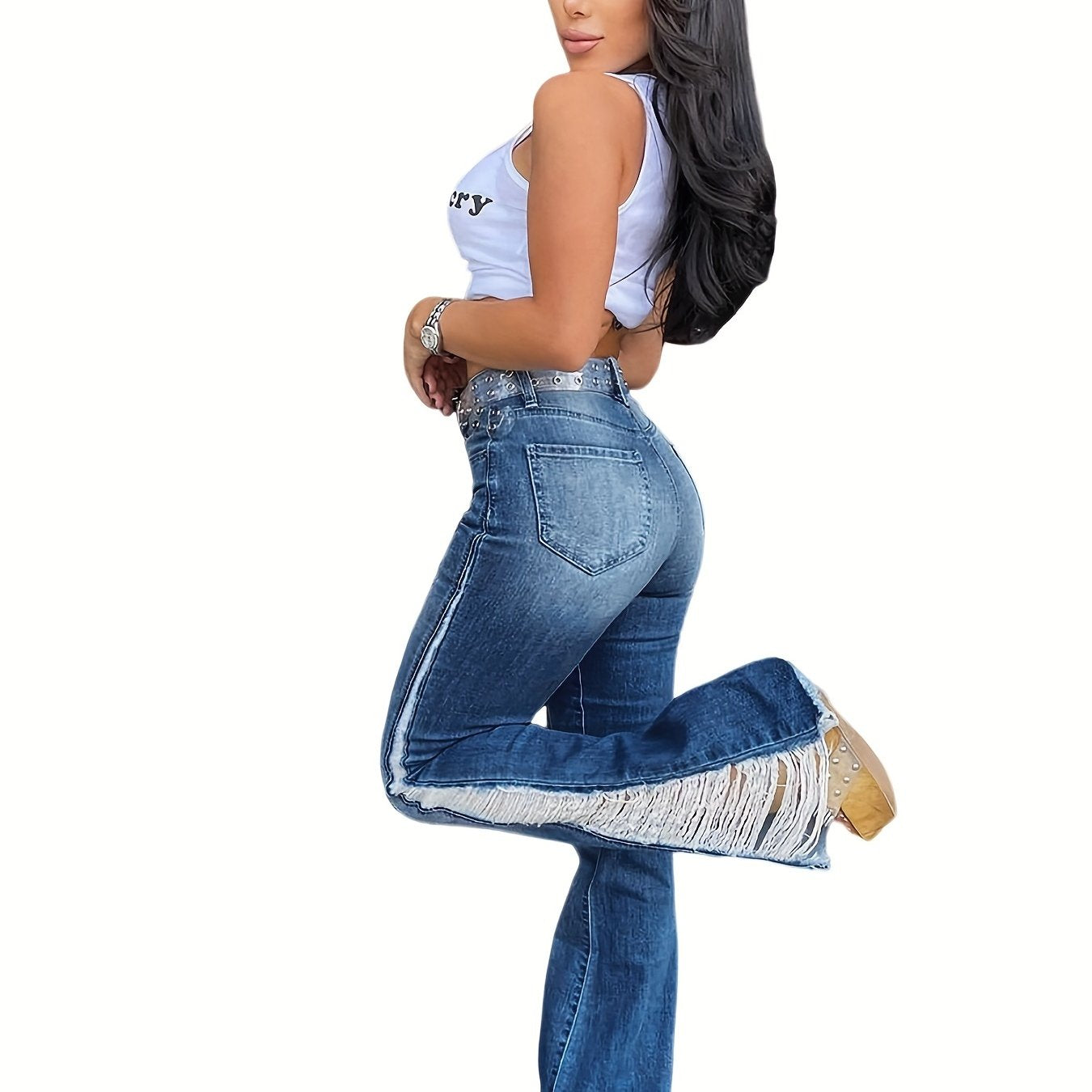 Woman wearing plus size washed ripped fringe trim flare leg jeans with split hem, perfect for Carnaval Music Festival.