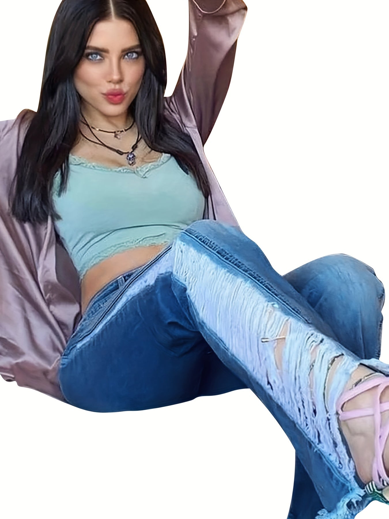 Woman wearing plus size casual ripped flare leg jeans with fringe trim and button fly, perfect for a Carnaval music festival.