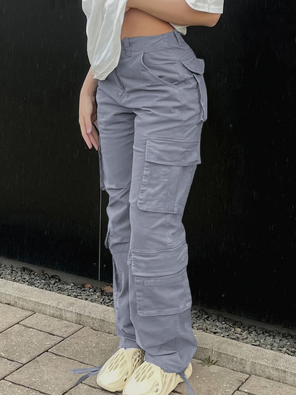 Woman wearing plus size Y2K inspired streetwear cargo jeans with side flap pockets, distressed denim, and high-waisted fit.